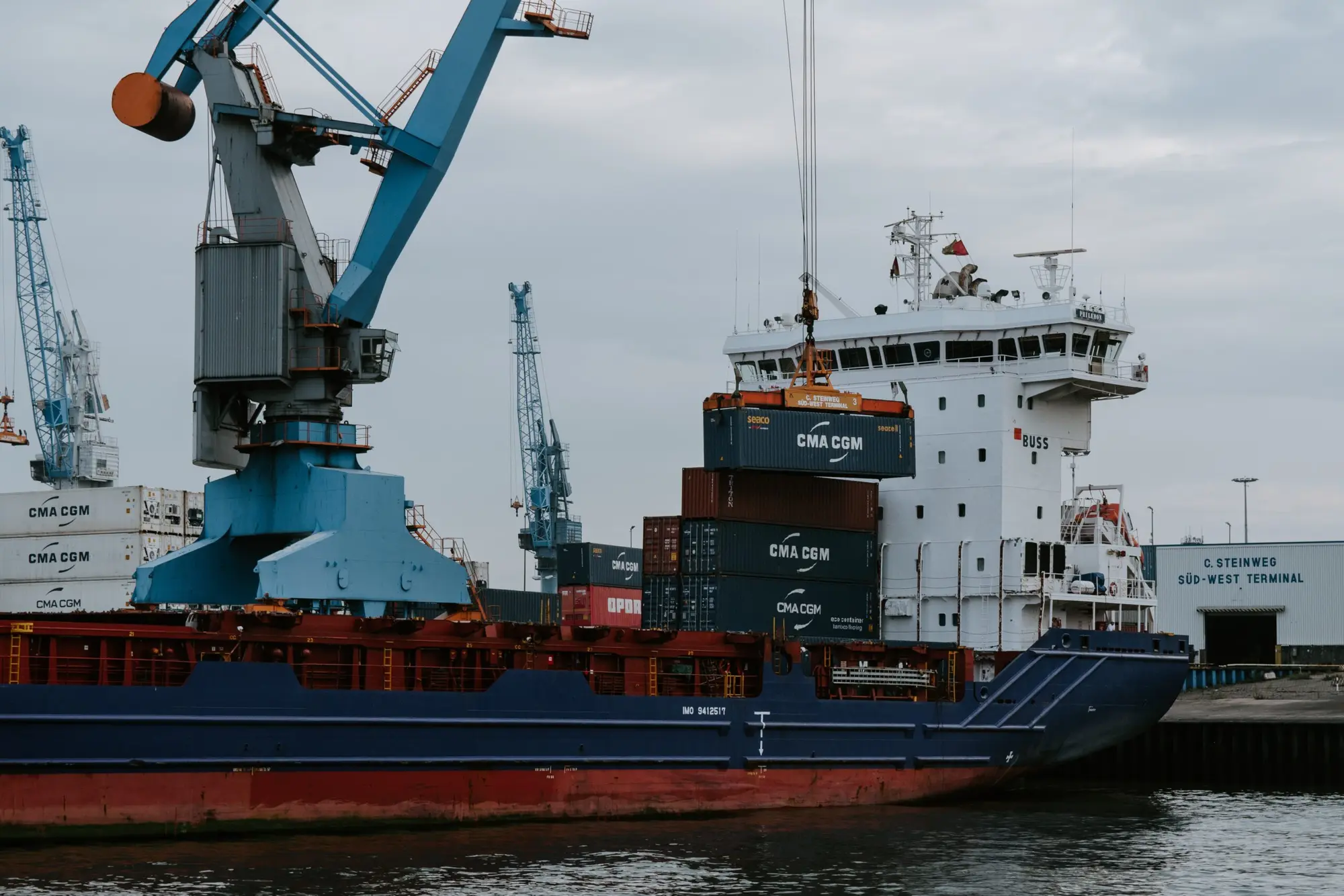 Container ship and cargo cranes at a port