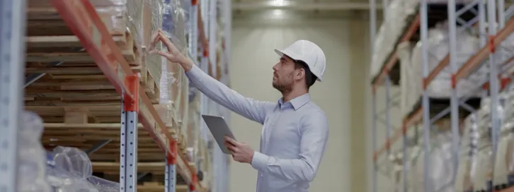 Specialist inspecting goods in a warehouse